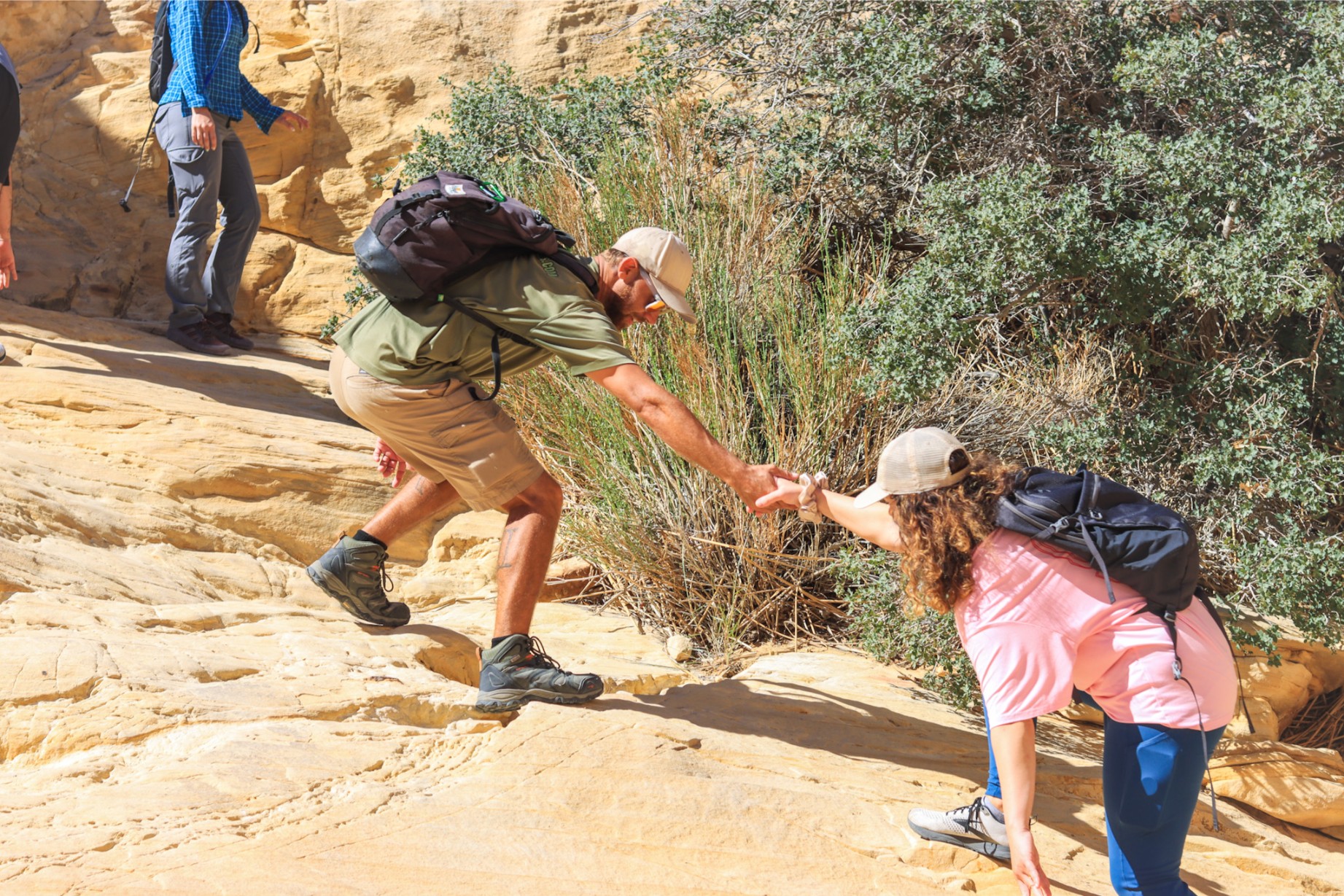 Trail guide helping a hiker